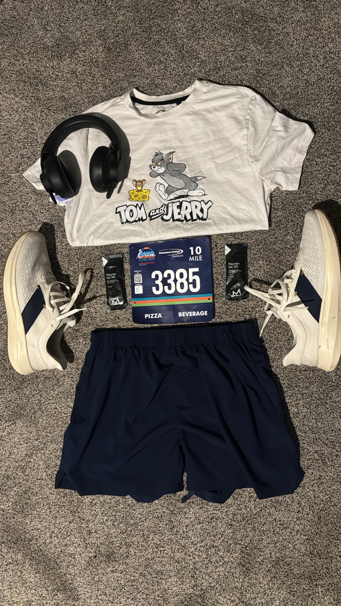 Race-day gear flat lay with bib
